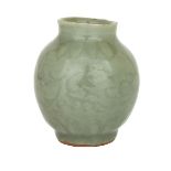 A LONGQUAN CELADON ‘LOTUS’ VASE, MING DYNASTY (1368-1644) 明 龍泉窯刻花小瓶 Heavily potted, supported on a