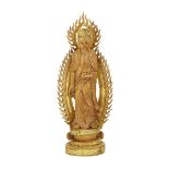 AN UNUSUAL IVORY FIGURE OF BUDDHA, EARLY 20TH CENTURY 20世紀早期 牙雕菩薩立像 Standing on a raised plinth,