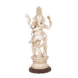 A LARGE AND RARE CARVED IVORY FIGURE OF GANESHA WITH ATTRIBUTES, ORISSA, INDIA, LATE 19TH CENTURY