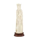 A CHINESE CARVED IVORY FIGURE OF A SCHOLAR, CIRCA 1940 牙雕高仕 With a serene and contemplative