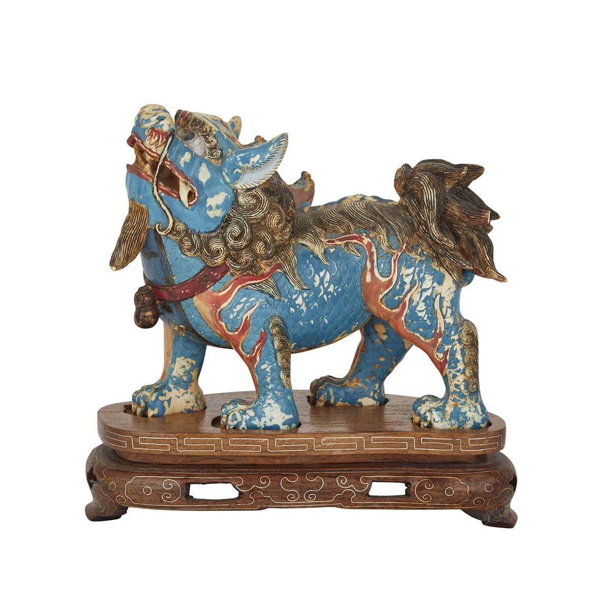 A CARVED POLYCHROMED IVORY QILIN, 19TH CENTURY 清十九世紀 牙雕加彩麒麟 The beast finely carved, standing