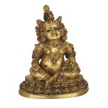 A GILT BRONZE FIGURE OF JAMBHALA, 18TH CENTURY OR LATER 十八世紀或更晚 西藏 銅鎏金黃財神 The rotund figure seated