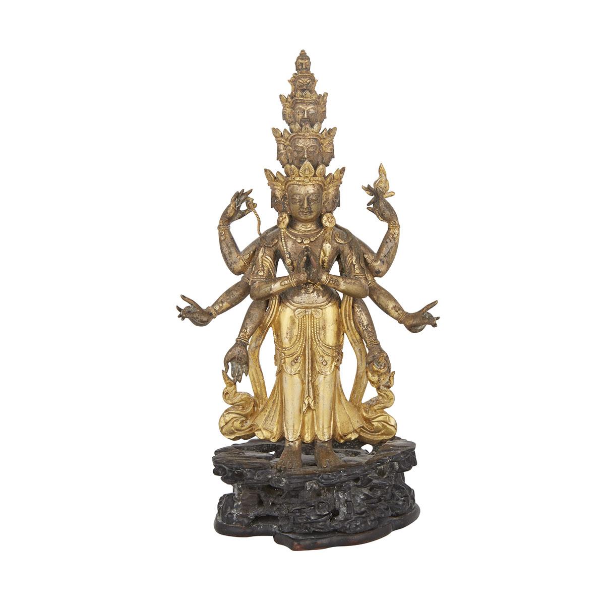 A GILT BRONZE FIGURE OF AN ELEVEN-HEADED AVALOKITESVARA, SINO-TIBET, 18TH CENTURY 清十八世紀 铜鎏金十一面觀音