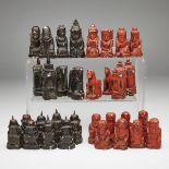 BURMESE CARVED BONE FIGURAL ‘SITTUYIN’ OR CHESS SET, EARLY 20TH CENTURYone side lacquered red, the