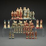 FRENCH CARVED AND POLYCHROMED IVORY FRANCE VS. HOLY ROMAN EMPIRE FIRGURAL CHESS SET, MID 19TH