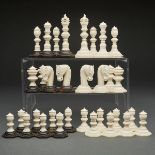 LARGE TURNED AND CARVED IVORY AND EBONY CHESS SET, LATE 19TH/EARLY 20TH CENTURYone side all ivory,