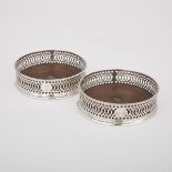 PAIR OF GEORGE III SILVER WINE COASTERS, THOMAS JUSTIS (PROBABLY), LONDON, 1775with pierced