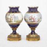 PAIR OF ORMOLU MOUNTED ‘SÈVRES’ BLUE GROUND VASES, LATE 19TH CENTURYpainted in colours with