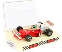 A scarce 1970’s French Scalextric TEXACO McLaren M23 (C120). In red with white rear wing with red,