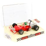 A scarce 1970’s French Scalextric TEXACO McLaren M23 (C120). In red with white rear wing with red,