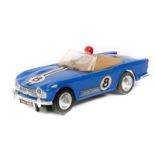 A 1960’s Scalextric ‘Race Tuned’ series Triumph TR4A. An example in blue with tan tonneau, RN8,