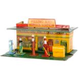 A 1930’s Dinky Toys ‘Filling and Service Station’ (48). A tinplate ‘building’ finished in dark green