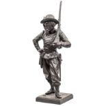 A well modelled bronzed figure of a 19th century Italian carabinieri, in full dress with feather