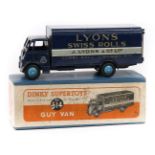 Dinky Supertoys Guy Van ‘Lyons Swiss Rolls’ (514). In dark blue livery with mid blue wheels.