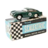 A scarce 1960’s Scalextric Aston Martin DB5 (MM/C.57). In British Racing Green with light brown