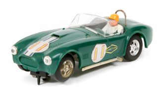 A 1960’s Scalextric ‘Race Tuned’ series AC Cobra. In British Racing Green, RN11, black tonneau,