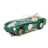 A 1960’s Scalextric ‘Race Tuned’ series AC Cobra. In British Racing Green, RN11, black tonneau,