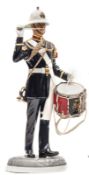 A painted “Michael Sutty Porcelain Manufactory” figure of a “Bugler, Royal Marines, 1989”, in full