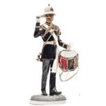 A painted “Michael Sutty Porcelain Manufactory” figure of a “Bugler, Royal Marines, 1989”, in full