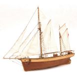 An unidentified 2 masted schooner, 24” long x 20” high, no stand. GC