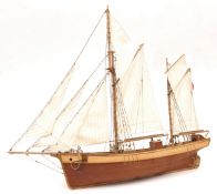 An unidentified 2 masted schooner, 24” long x 20” high, no stand. GC