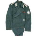 An SS Police Panzer officer’s uniform, comprising special pattern green cross-over jacket. Machine
