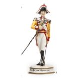 A small scale “Michael Sutty Porcelain Manufactory” figure of a “Drum Major 34th Regiment, 1811”, in