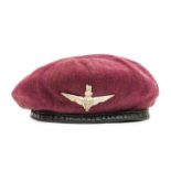 A scarce WWII maroon beret of The Parachute Regt, WM badge, the slide numbered “5347925” en suite