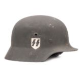 A Waffen SS M1940 steel helmet, single decal runes badge on right side, size stamp “54” on leather