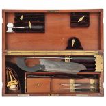 A late 19th Century surgeon’s brass bound mahogany instrument case, containing scalpels, dental