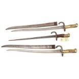 2 Chassepot bayonets, d 1872, in scabbards (some wear, scabbards cleaned over pitting) and a Gras