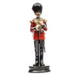 A similar figure of a bandsman “Coldstream Guards” in full dress with clarinet and sidearm, “Model