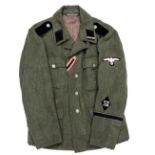 An SD Man’s M1942 tunic, field grey material, machine sewn black collar patches, blank right side,