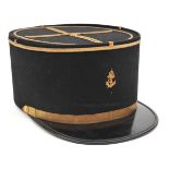 †A French naval officer’s blue kepi, gilt braid cross and trim to top, PL peak, small fouled