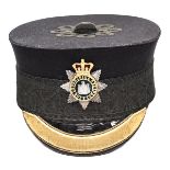 A good Victorian officer’s peaked forage cap of The Devonshire Regiment, of blue cloth with black