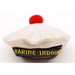 †A “Marine Indochine” round cap, embroidered title headband with scarlet edge piping, scarlet wool