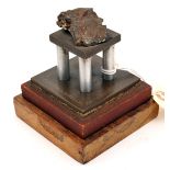 A Jutland souvenir desk weight, in the form of a shell fragment mounted on a bronze, steel and