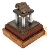 A Jutland souvenir desk weight, in the form of a shell fragment mounted on a bronze, steel and