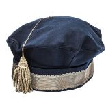 A Georgian cavalry officer’s blue cloth tent cap, wavy edged plain gilt lace headband, bullion