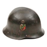 An Eastern European steel helmet, the dark grey/green skull with low medial ridge and with white/