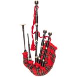 A good quality set of Scottish bagpipes by R G Lawrie Limited, turned wood chanter and drones, ivory
