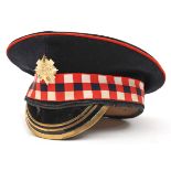 †A Sergeant’s peaked cap of the Scots Guards, diced silk headband, staybrite badge, 3 brass bands to