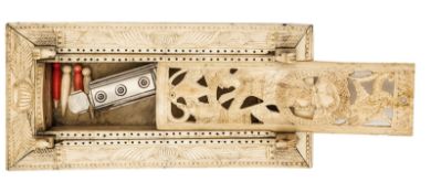A French Napoleonic prisoner of war carved bone games box, the top panels carved with foliate