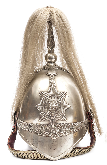 A trooper’s white metal helmet, c 1905, of the Montgomeryshire Imperial Yeomanry, white metal mounts