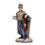 A Michael Sutty painted porcelain figure “Trumpeter RHA”, in full dress with busby and cape, holding