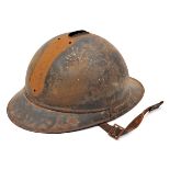 A WWI French Adrian pattern steel helmet, with leather lining and chinstrap. QGC (rusted, no crest