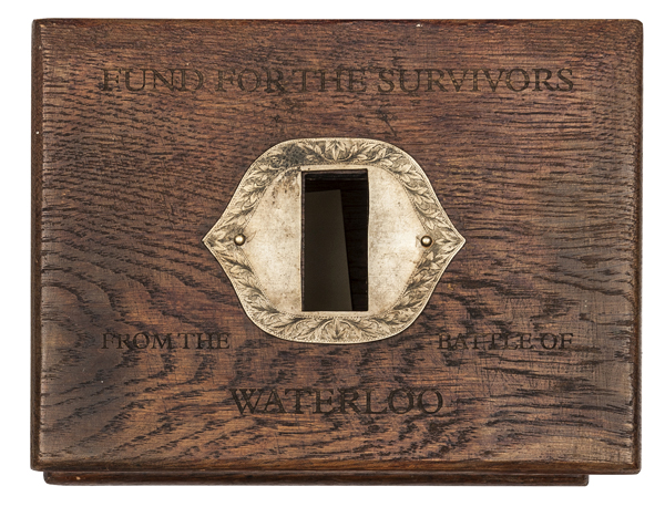 An oak collection box, lid engraved in capitals “Fund for the Survivors from the Battle of