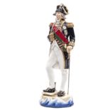 A Michael Sutty large painted porcelain figure “Lord Nelson 1805” in full dress with bicorne hat,
