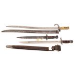A Chassepot bayonet in scabbard, a US M1913 bayonet in scabbard and another. QGC to GC (3)