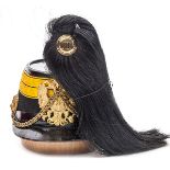 †An Austrian M1870 Artillery NCO’s shako, black cloth body with Patent leather peak, headband and